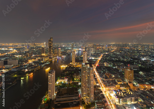 Aerial view of Bangkok Downtown Skyline, Thailand. Financial district and business centers in smart urban city in Asia. Skyscraper and high-rise buildings with Chao Phraya River.