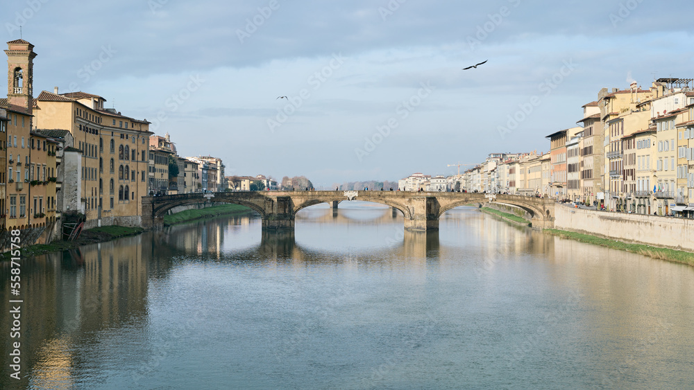 Morning view of river Arno and Ponte Santa Trinita from Ponte Vecchio in Florence, Italy