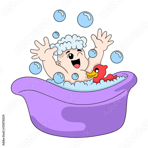 baby boy is taking a bath happily playing soap bubbles