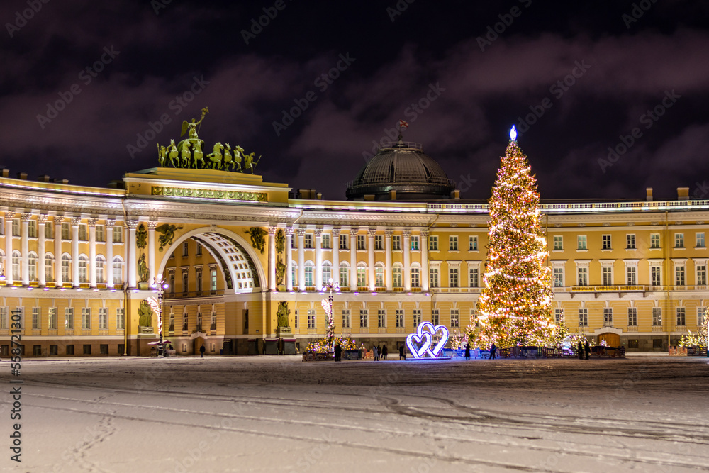 New Year's tree on the Palace Square and the arch of the General Staff building in St. Petersburg in the  winter night.