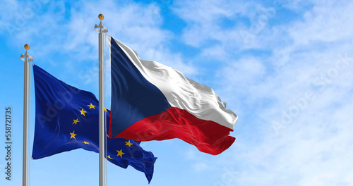 The flags of Czech Republic and the European Union waving together on a clear day