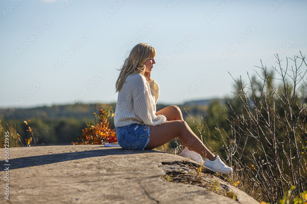 aerial view on girl stays on rock or concrete ruined structure aerial view on girl stays on rock or concrete ruined structure
