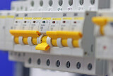 automatic current switches for protection of electrical loads from short circuit, installed in an electrical switchboard.