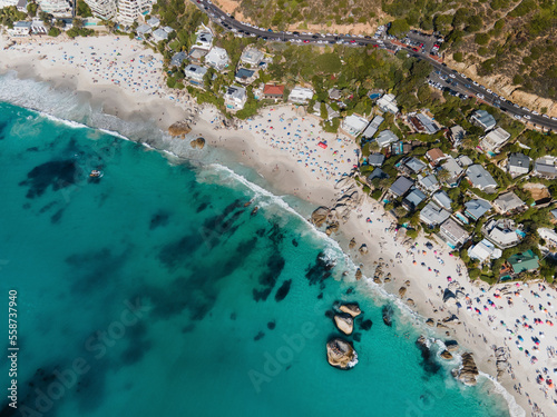 Aerial view of Clifton beaches pristine white sand and blue ocean with people swimming in summer, Cape Town, South Africa. photo