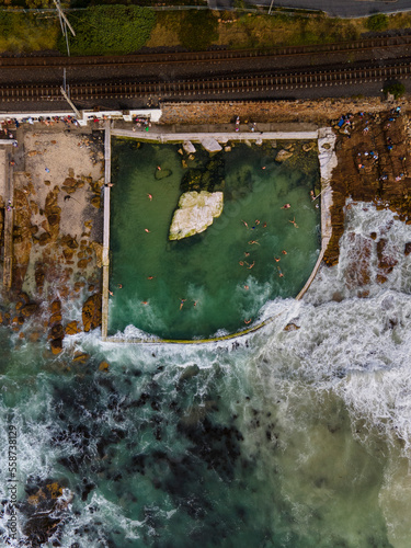 Aerial view of Dalebrook tidal pool early morning swimmers, Cape Town, South Africa. photo