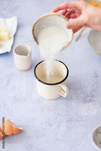 Pouring sugar in to a cup
