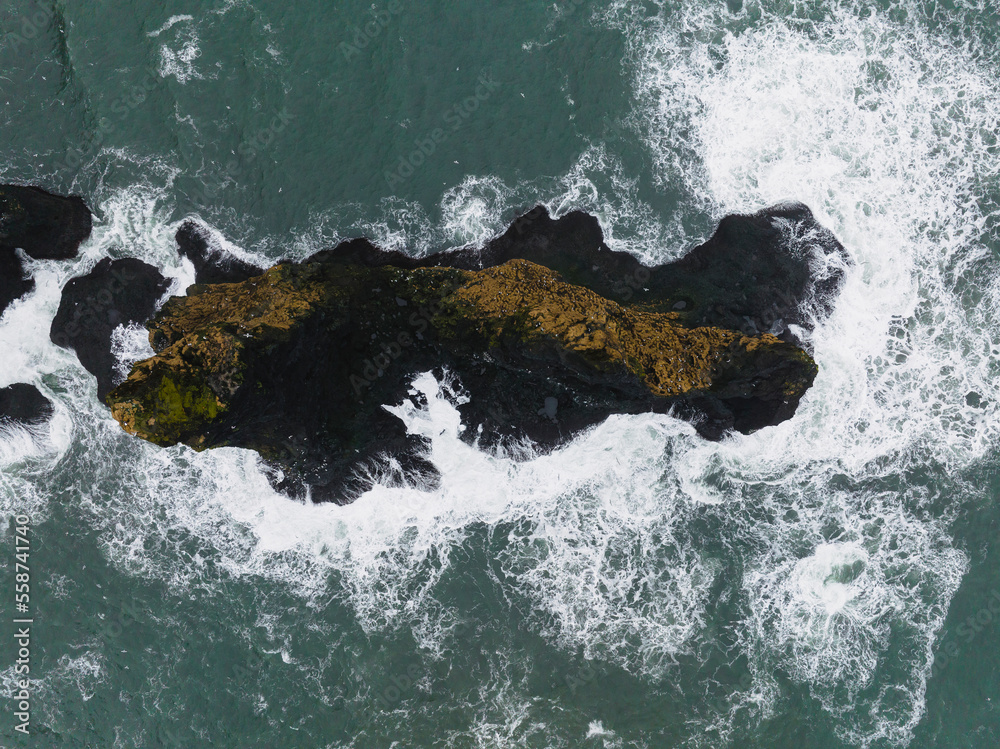 Aerial view of Reynisdrangar rocks, basalt sea stacks situated under ...