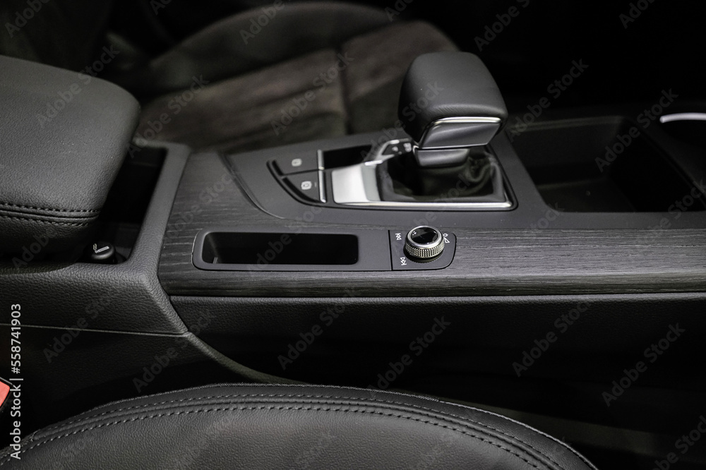 Automatic transmission selector with leather in the interior of a modern expensive car