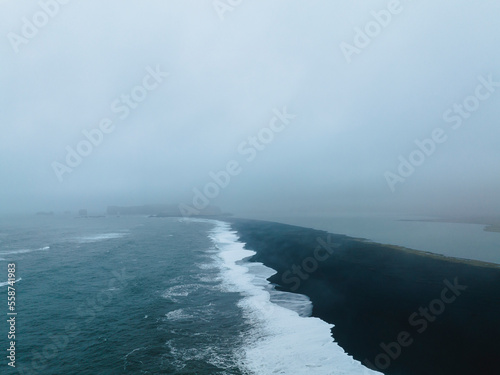 Aerial view of Reynisdrangar rocks under the mountain Reynisfjall, Iceland. photo