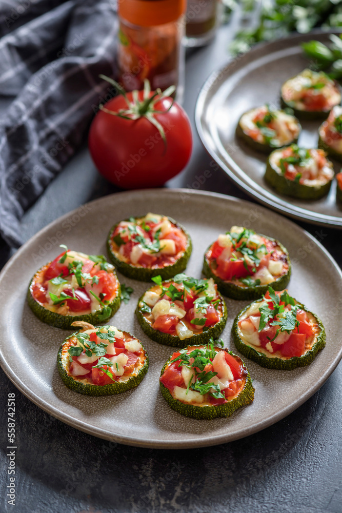 Baked zucchini with tomatoes and cheese.