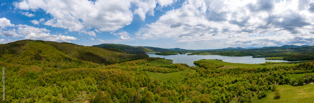 Amazing huge aerial panorama from to green countryside and a lake