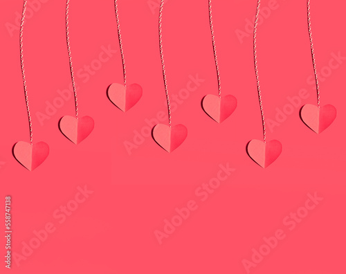 Valentine's Day background. Beautiful cute hearts on pastel pink table flat lay composition. Valentines Day greeting card concept.
