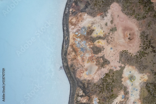 Aerial view of a coastline along the lakefront at Gunnuhver Hot Springs (Geo Thermal Hot Spring), Grindavík, Iceland.