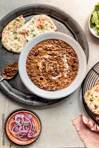 Dal Makhani served with Naan bread and onion salad photo