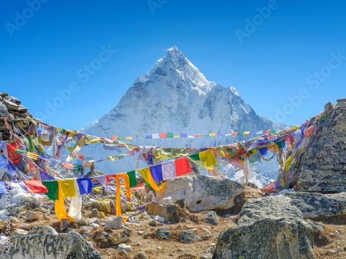 view to summit Ama-Dablam through prayer flags on high 4808m in Nepal like a high of Mont Blanc © sergejson