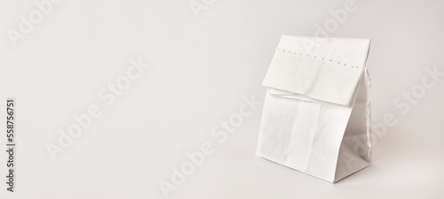 Fotografija A sewn bag on a white background. Packaging of food products.