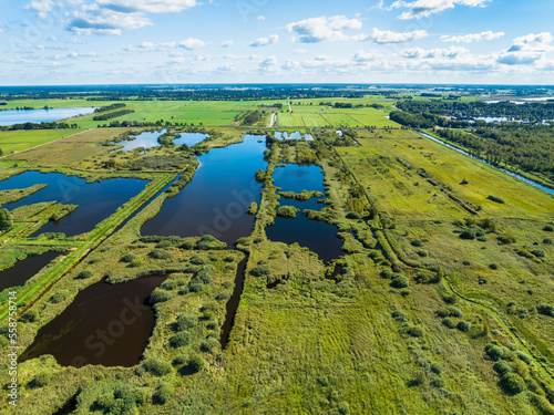 Aerial view of reedland, bushes and lakes in national park De Alde Feanen, Earnewald, Friesland, Netherlands. photo