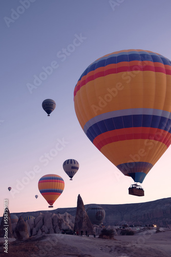 Colorful hot air balloons. Sunrise at Cappadocia. Bright colorful ballons ascending during sunrise in valley. Goreme, Nevsehir, Cappadocia