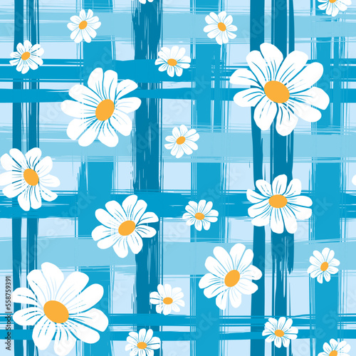 Spring pattern of chamomile flowers of different sizes on a blue checkered background. Vector seamless pattern.