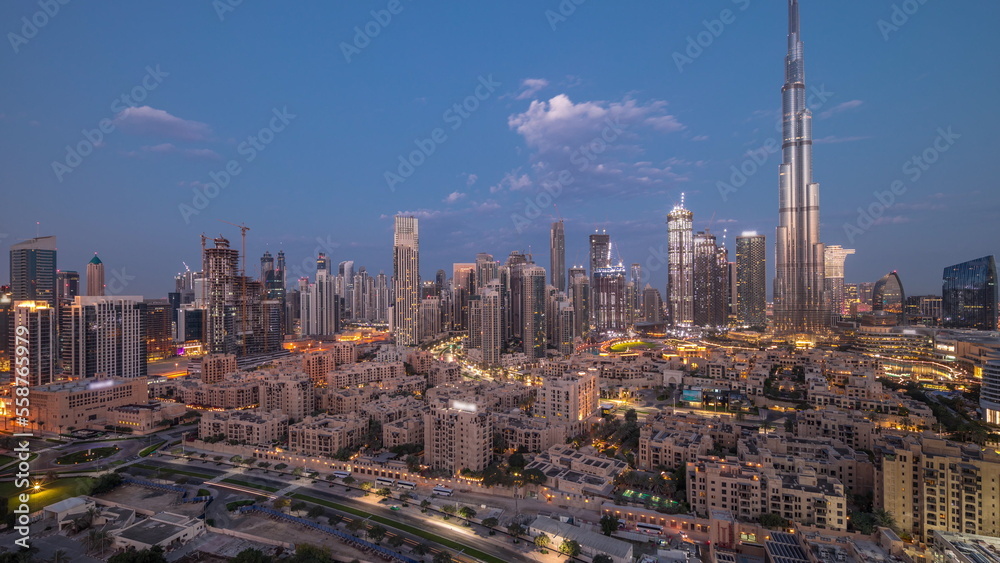 Obraz premium Dubai Downtown night to day timelapse with tallest skyscraper and other towers