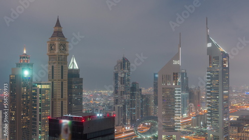 Skyscrapers on Sheikh Zayed Road and DIFC day to night timelapse in Dubai  UAE.