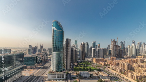 Panorama showing Dubai's business bay towers aerial morning timelapse. Rooftop view of some skyscrapers