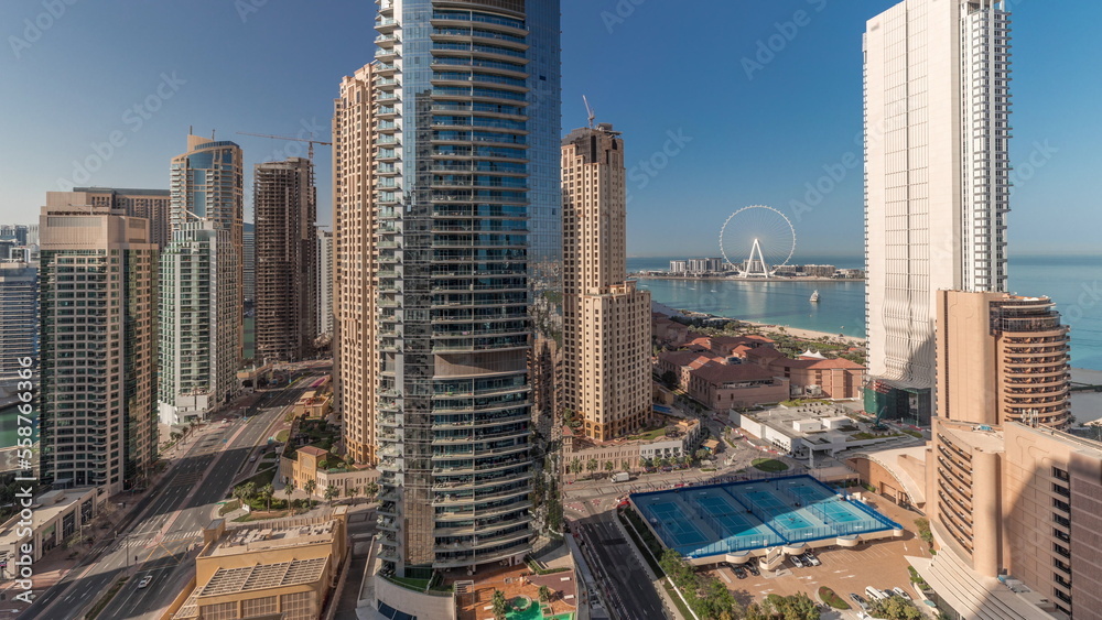 Obraz premium Panoramic view of the Dubai Marina and JBR area and the famous Ferris Wheel aerial timelapse