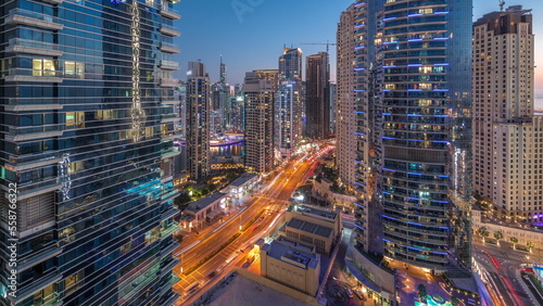 Panoramic view of the Dubai Marina and JBR area and the famous Ferris Wheel aerial day to night timelapse