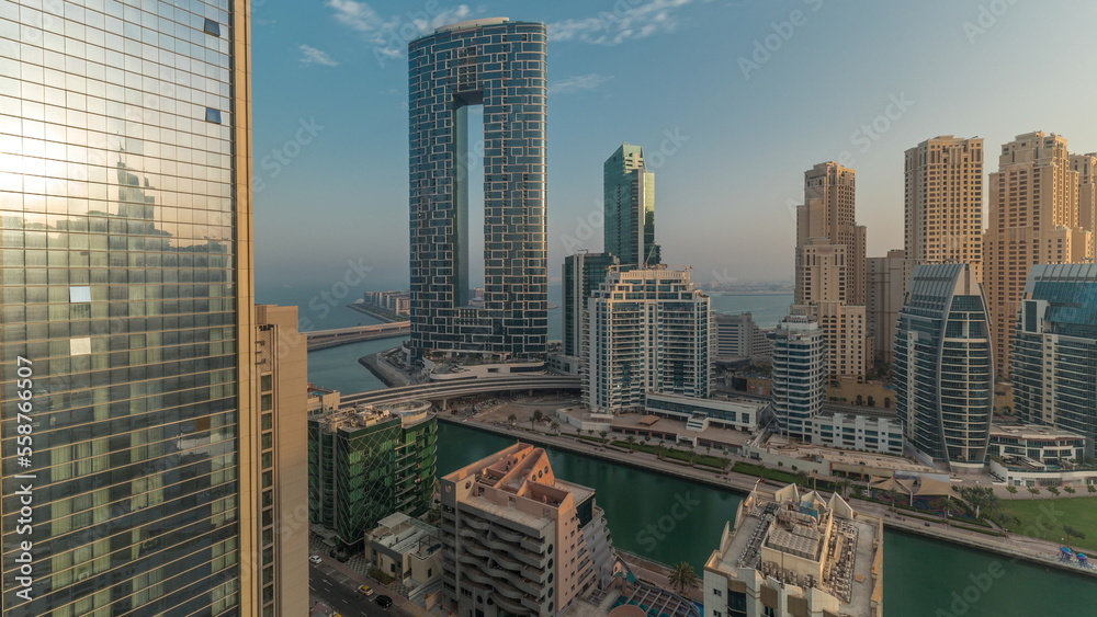 Fototapeta premium Dubai Marina skyscrapers and JBR district with luxury buildings and resorts aerial timelapse
