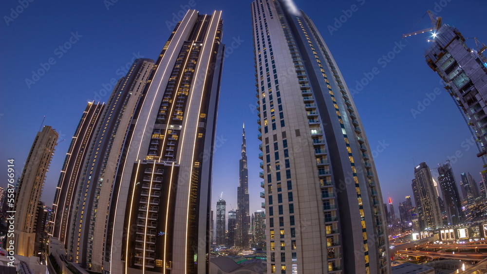 Panorama of tallest skyscrapers in downtown dubai located on bouleward street near shopping mall aerial day to night timelapse.