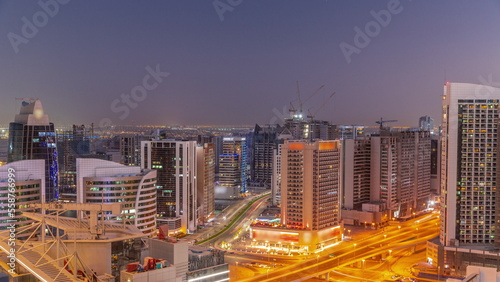 Skyscrapers at the Business Bay in Dubai aerial day to night timelapse  United Arab Emirates
