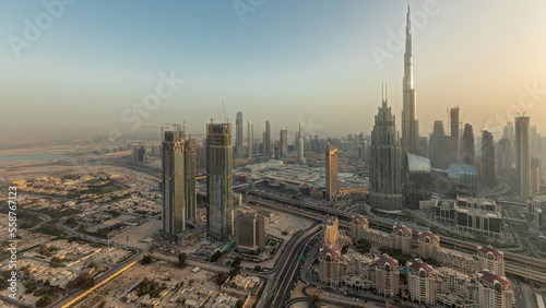 Panorama showing aerial view of tallest towers in Dubai Downtown skyline and highway timelapse. © neiezhmakov