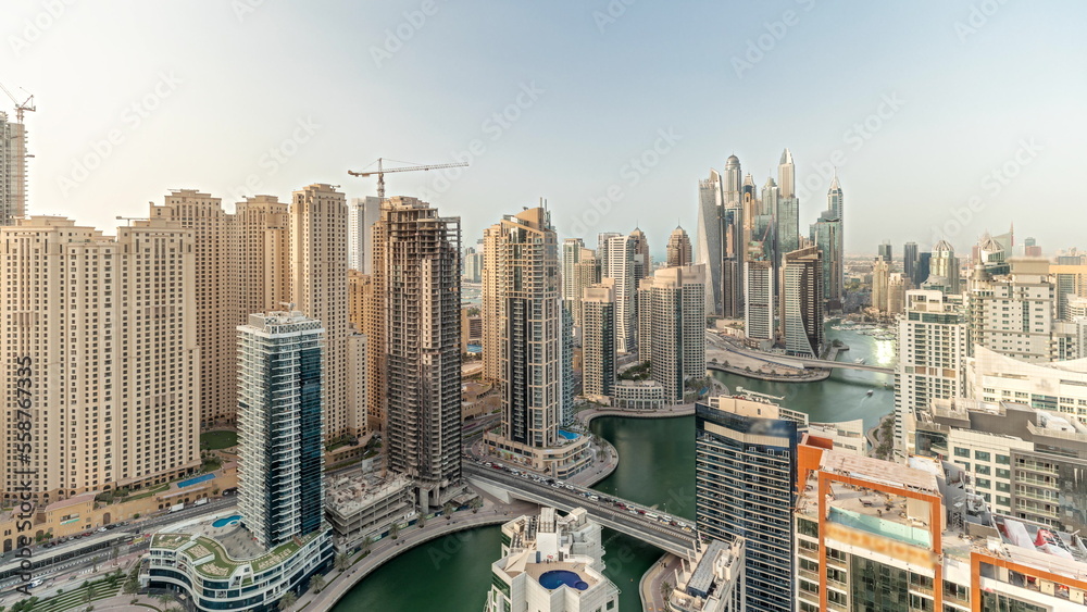 Panorama showing various skyscrapers in tallest recidential block in Dubai Marina aerial timelapse