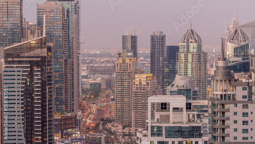 Dubai Marina and Media City districts with modern skyscrapers and office buildings aerial day to night timelapse. © neiezhmakov
