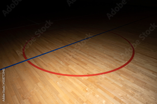 Wooden floor basketball, badminton, futsal, handball, volleyball, football, soccer court. Wooden floor of sports hall with marking lines on wooden floor indoor, gym court photo