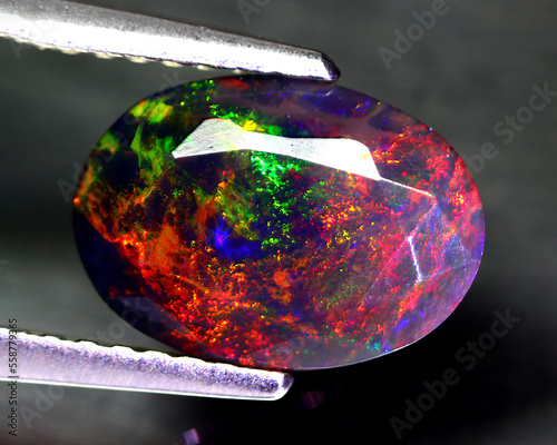 Schilderij op canvas Natural beautiful gemstone opal on gray background