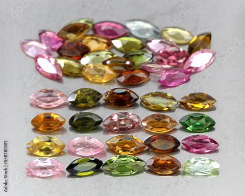 Natural beautiful gemstones multicolored tourmaline on a gray background