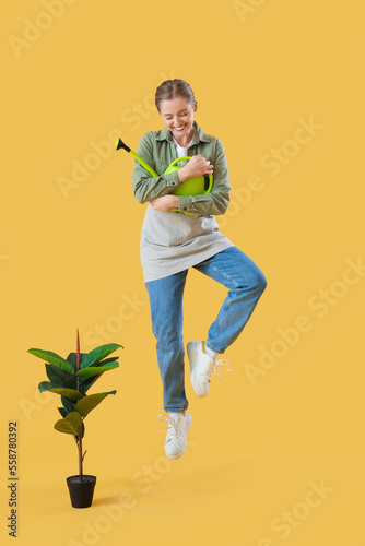 Female gardener with wateri...