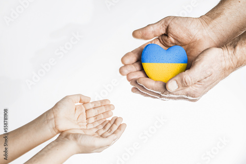hands give yellow blue heart