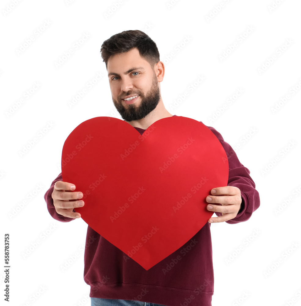 Young bearded man with big paper heart for Valentine's Day on white background Young bearded man with big paper heart for Valentine's Day on white background