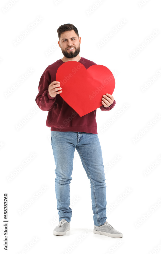 Young bearded man with big paper heart for Valentine's Day on white background Young bearded man with big paper heart for Valentine's Day on white background