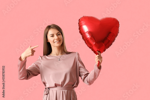 Young woman with balloon fo...