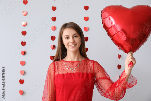 Young woman with balloon fo...