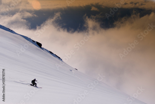 A man skiing on a glacier on Mount Vsesevidov in the Aleutian Islands in Alaska.