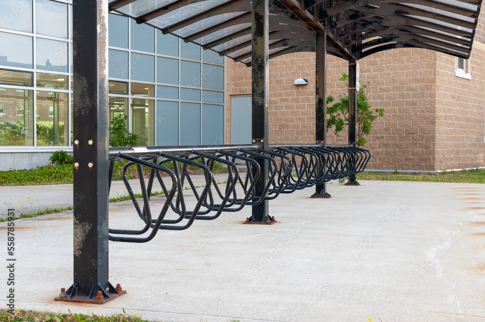 Large black metal bicycling hub racks. The curved wave shape of the ...