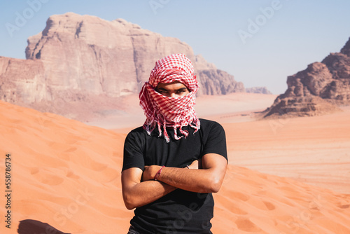 arab man with scarf in the desert