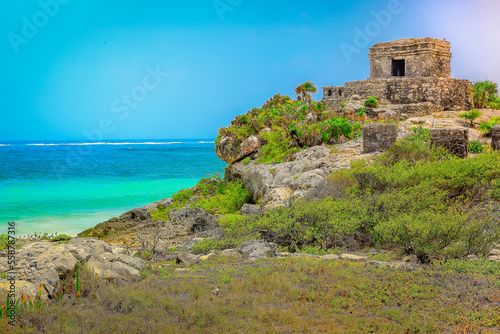 Tropical paradise, sand beach in caribbean with palapa and pier, Cancun, Mexico