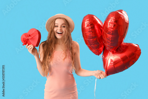 Happy young woman with hear...