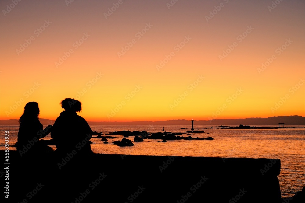 silhouette of a couple at sunset beach