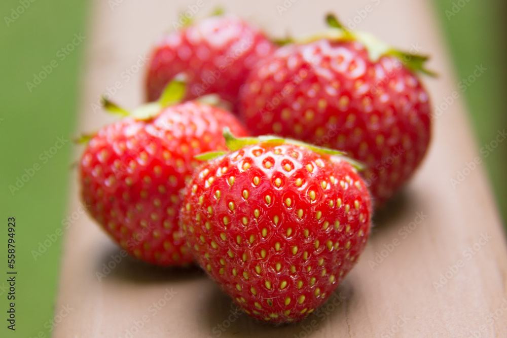 strawberries on a wooden table strawberries on a wooden table